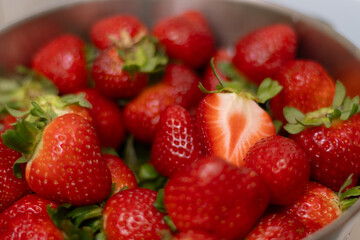 Closeup bowl full of strawberries. Background 