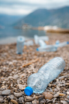 Plastic waste on the rocky beach.