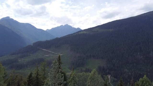 Drone Aerial Horizontal Up Motion Nature Shot of Mountains and Valley in British Columbia Beaver Canada
View of Forest, Trees, Mountains, Sky, Clouds | Aerial Landscape View of Trees and Valley