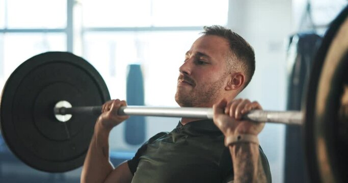 Man, barbell and press exercise in gym for workout, functional training or muscle strength in fitness club. Serious bodybuilder, heavy weightlifting and challenge of strong power, endurance or energy