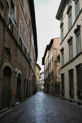 Fototapeta na wymiar Narrow street in the italian town. Streets in town Lucca