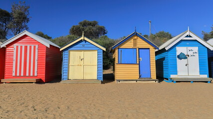 Fototapeta na wymiar Partial row of the 82 brightly painted Victorian bathing boxes on Dendy Street Beach, Brighton suburb. Melbourne-Australia-897