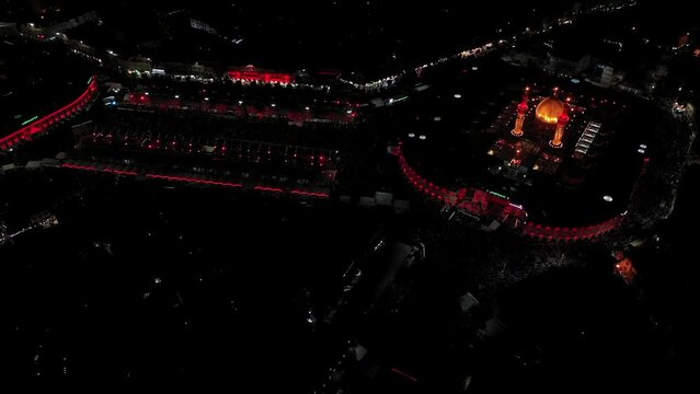 Imam Husayn and Al-Abbas ShrinA night shot by a drone of Shiite visitors and pilgrims at the mosque and shrine of Imam Hussein and Abbas in Karbala, Iraqe