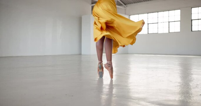 Dance, feet and a ballet woman for performance in a creative art studio with energy and passion. Legs, spin and shoes of ballerina dancer for theater and freedom with balance, textile and space