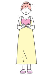 ハートを持った笑顔の女性