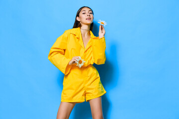 young woman flower yellow blue person model happiness portrait chamomile smile