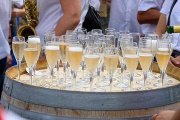 Tasting of sparkling white wine with bubbles champagne on summer festival route of champagne in...