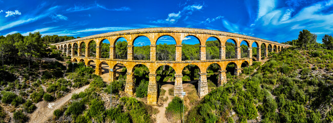 The Ferreres Aqueduct, also known as the Pont del Diable, is an ancient Roman bridge in Tarragona in Catalonia, Spain - obrazy, fototapety, plakaty