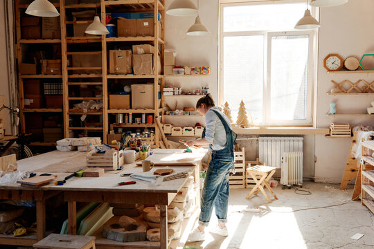 Wood designer practicing pyrography