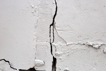 Home building problem. Cracked concrete wall, broken building structure