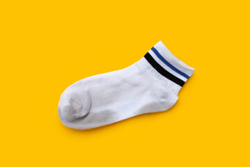 White socks on yellow background.