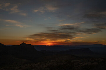 Traces of Sunset Linger Across Sky and Mountain Silhouettes