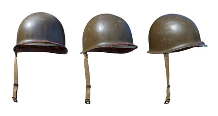 Vintage World War II United States army helmets at various angles isolated on white