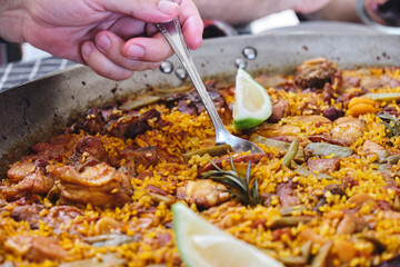 Eating an authentic Valencia Spanish Paella with a spoon.