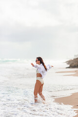Fototapeta premium Happy woman on the beach vacation