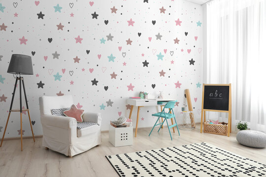 Modern room interior for child with comfortable furniture and cute wallpapers