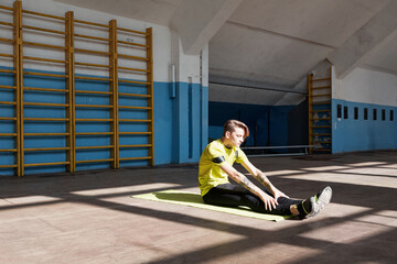 Young man improving flexibility