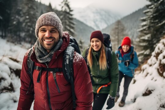 Diverse Group Of People And Friends Hiking Together In The Forests And Mountains During Winter And Snow