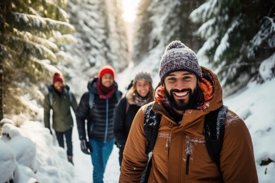 Diverse Group Of People And Friends Hiking Together In The Forests And Mountains During Winter And Snow