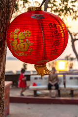 Decorative red lantern shades,at sunset,outside Buddhist temple,Pakse,Laos.