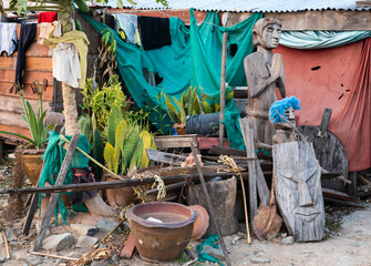 Various objects,placed outside a shack,next to the Mekong river,Pakse,Laos.