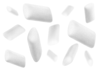 Many chewing gum pads falling on white background