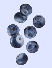 Many ripe blueberries falling on color background