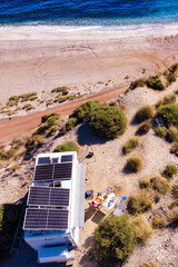 Caravan with tilt solar panels on roof. Aerial view.