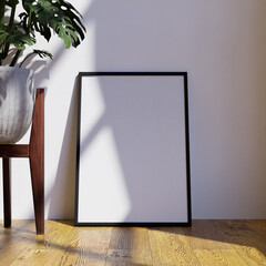 simple minimalist frame mockup poster on the floor leaning on the white wall with plant and pot as decoration