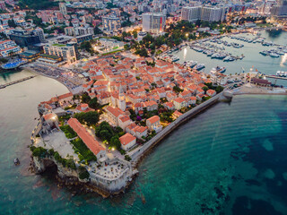 Budva city lights from Montenegro seen from above. Night view. Drone old town Budva at night