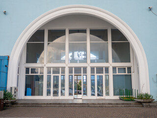 Semicircle of the facade of the building. Beautiful facade of the port building.