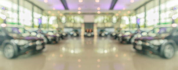 new cars in showroom interior blurred abstract background - obrazy, fototapety, plakaty