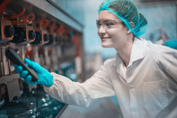 Water production team uses barcode scanners to ensure accurate bottle arrangement under guidance