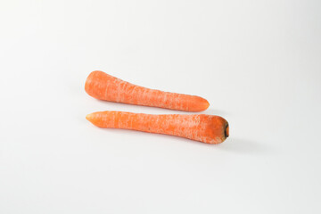 Photo of Fresh carrots isolated on white background.