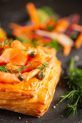 Golden baked homemade Danish pastry with cream cheese, smoked salmon, baby capers and fresh dill.