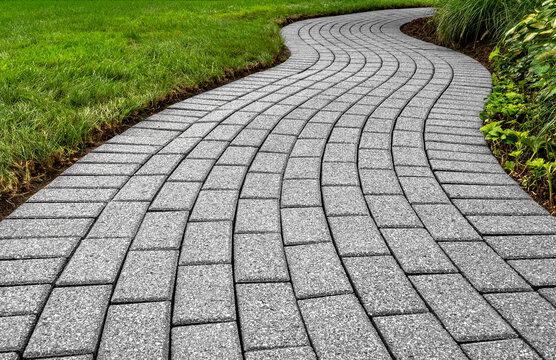 Brick pavers arranged in a curving pattern.
