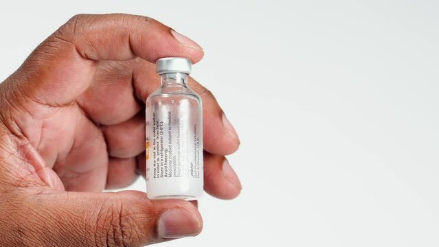 Fingers Hold An Insulin Bottle