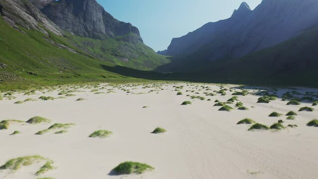Cinematic drone flying over the sand and private beach at Horseid Beach. Northern side of Moskenes&oslash;y, in the western part of Lofoten