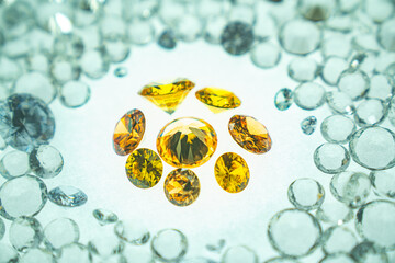 .Yellow gemstones is displayed on a white background swirling around..Golden diamonds of various sizes and shapes are displayed in the middle of white diamonds..Sweet gems diamonds.white gems 