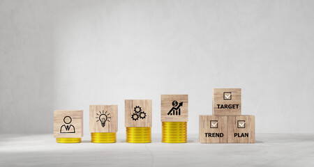 2024 Action Plan. Cubes with text 2024 and target, trend, and plan on coins stack. Business...