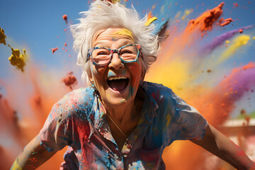 happy mature senior woman covered in powder paint explosion