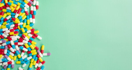 Lots of colourful pills and capsules for different symptoms. Concept of health and medicine.  