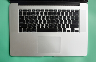 Black laptop keyboard, background use. 