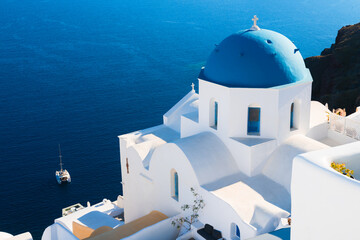 White architecture in Santorini island, Greece. Church with blue dome n Oia town