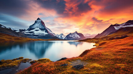 Fototapeta na wymiar Fantastic evening panorama of Bachalp lake / Bachalpsee, Switzerland. Picturesque autumn sunset in Swiss alps, Grindelwald, Bernese Oberland, Europe. Beauty of nature concept background.