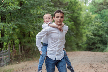 Fototapeta premium brothers are playing outdoor