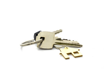 Real estate concept . Key ring and keys on white  background . Copy space