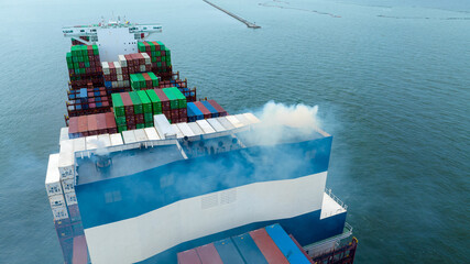 Smoke exhaust gas emissions from cargo lagre ship,Marine diesel engine exhaust gas from combustion, Gas Emission Air Pollution from transportation. forwarder mast, green house effect pollution concept - obrazy, fototapety, plakaty