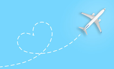 Airplane model with line trace in heart shape on blue background - obrazy, fototapety, plakaty