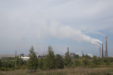 Environmental pollution. Smoke from the pipe of an industrial factory